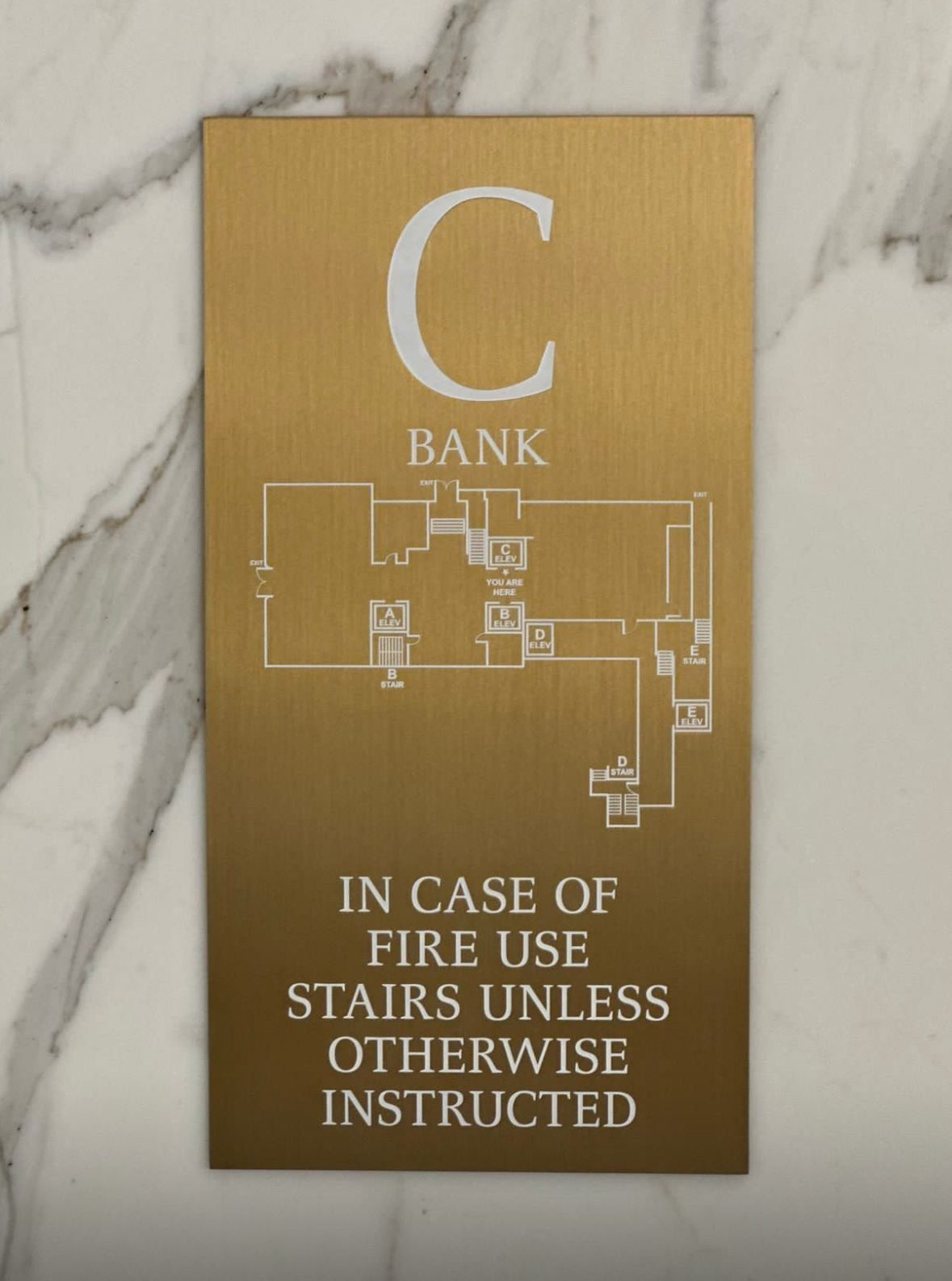 Image next to what is ADA Signs on bottom - MMK Custom Inc.